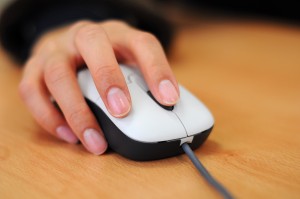 computer-woman-with-hand-on-mouse